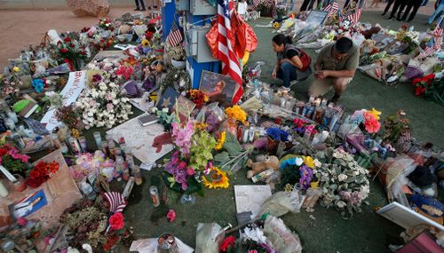 People visit a makeshift memorial for victims of the mass shooting in Las Vegas. (AP)