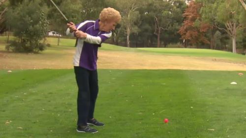 Ms Willcox shows off her swing. (9NEWS)