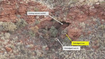 The dislodged tree and boulder at the sacred Nammuldi rock shelter in the WA Pilbara region.