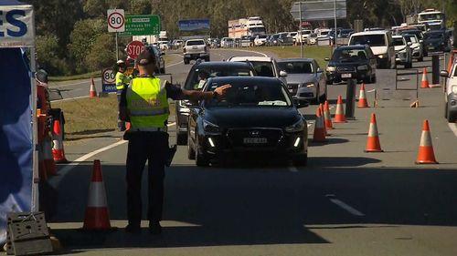 Queensland border delays lengthening as motorists line-up to get into the state.