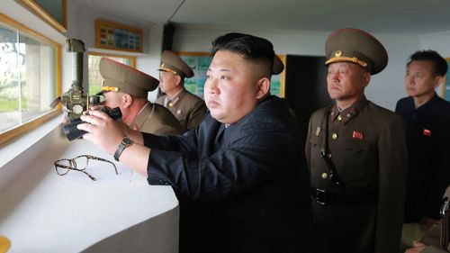 North Korean leader Kim Jong-Un (C) inspecting the defence detachment on Jangjae Islet and the Hero Defence Detachment on Mu Islet. (AFP)