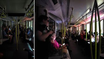 Commuters sit in the dark after problems hit the Sydney Metro line 