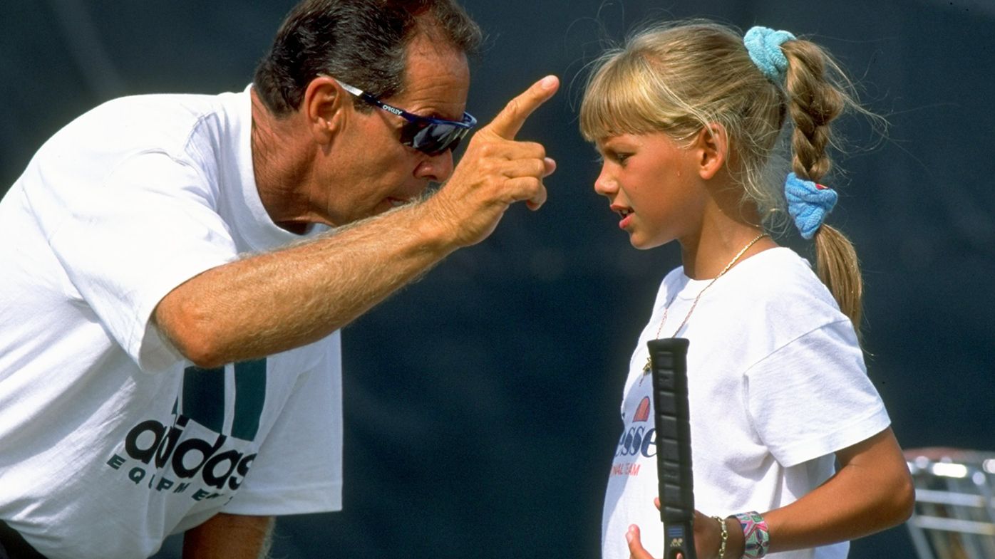 Nick Bollettieri gives instructions to a young Anna Kournikova.