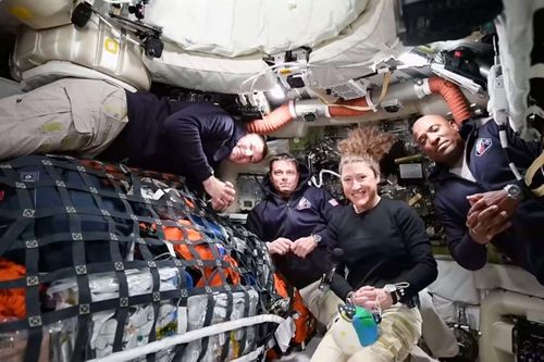 This image taken from video provided by NASA shows the Artemis II crew, from left, Canadian astronaut and mission specialist Jeremy Hansen, Commander Reid Wiseman, mission specialist Christina Koch and pilot Victor Glover as they appear on a video conference from the moon's orbit.
