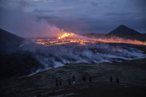 Lava emerges from a fissure of the Fagradalsfjall volcano near the Litli-Hrútur mountain, some 30 kilometres southwest of Reykjavik, Iceland, Monday July 10, 2023.  
