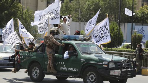 Taliban fighters celebrate the third anniversary of the withdrawal of US-led troops from Afghanistan, in Kabul, Afghanistan, Wednesday, August 14, 2024.