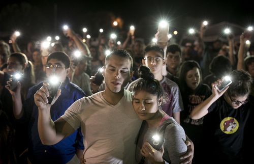 Matthew Mata and Erika Gonzalez participate in a memorial service for the victims of the church shooting in Texas. (AAP)