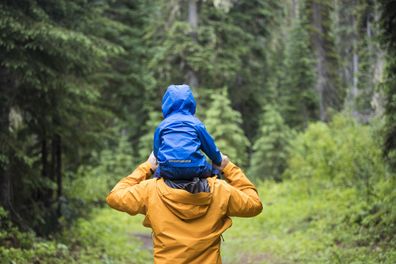 Father carrying son