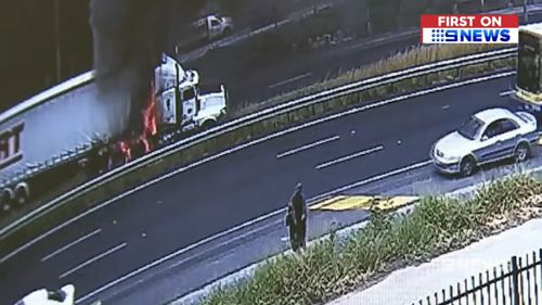 The truck driver had just moments to act before the truck was engulfed in flames. (9NEWS)
