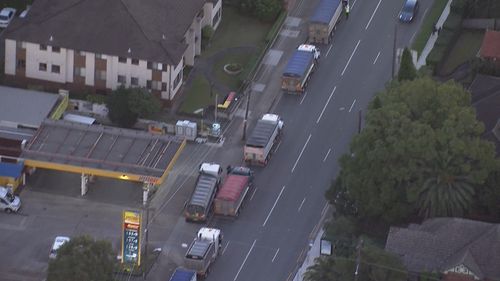 Dozens of trucks have stopped on the Sydney Harbour and Anzac Bridges this afternoon to seek assurances transport workers will be deemed essential.