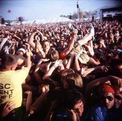 INDIO, CA - APRIL 27: (EDITOR'S NOTE: IMAGE TAKEN WITH A HOLGA CAMERA) A fan crowd surfs at the Coachella Valley Music and Arts Festival at the Empire Polo Fields on April 27, 2008 in Indio, California. The Coachella Music and Arts Festival has attracted thousands of attendees to the Coachella Valley since 1999. (Photo by Rick Gershon/Getty Images)