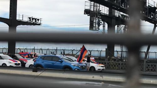 Protesters on the Sydney Harbour Bridge stopped traffic.