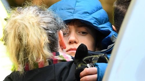 William Callaghan is hugged by his mum at the base camp at Mount Disappointment. He was found alive after two cold nights in Victoria's bush