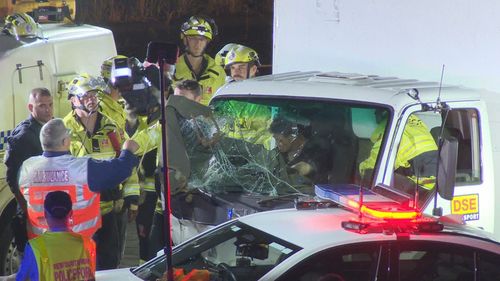 A man in an allegedly stolen truck has left a trail of destruction across Western Sydney after ramming into police cars and hitting a school crossing.