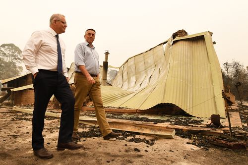 Prime Minister Scott Morrison (L) and Darren Chester MP tour the Wildflower farm owned by Paul and Melissa Churchman on January 3, 2020 in Sarsfield, Victoria, Australia. (Photo by James Ross-Pool/Getty Images)