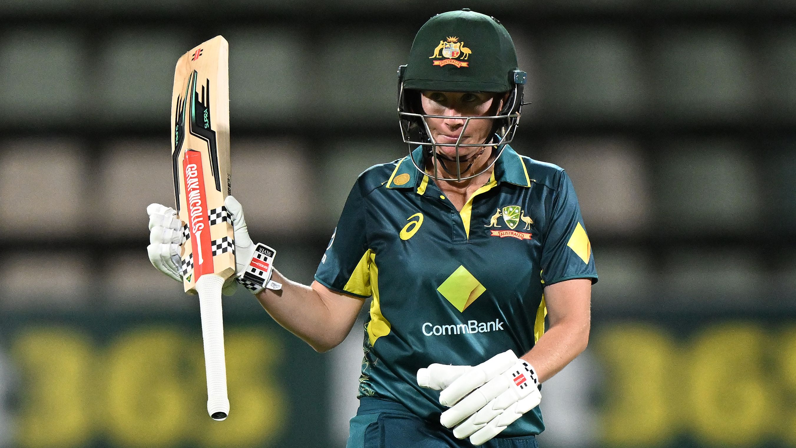 Beth Mooney celebrates scoring a half-century during game three of the women&#x27;s T20I series between Australia and South Africa at Blundstone Arena.