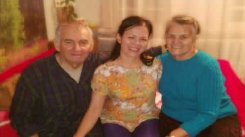 Valentina Suman, middle, reunited with her parents Nikolay Lashtur, left, and Vera Lashtur, right, after being switched at birth. (Supplied)