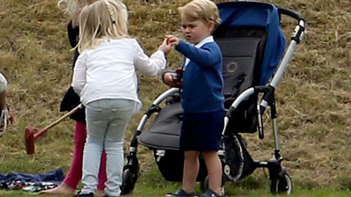 The prince wandered around with a toy car and played with other kids at the event. (AAP)