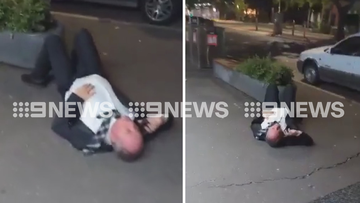 Barnaby Joyce has been captured lying on a pavement in Canberra by an onlooker.