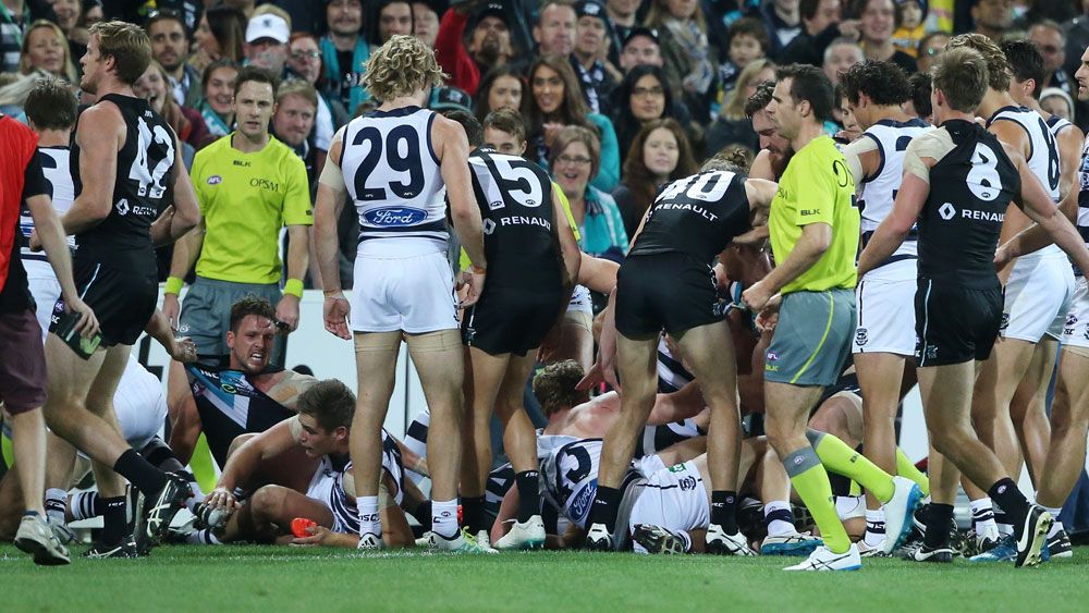 Port and Geelong players were involved in a wild melee at quarter time. (AAP)