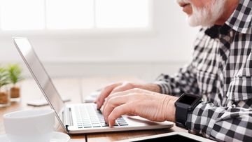 Old man hands elderly computer laptop
