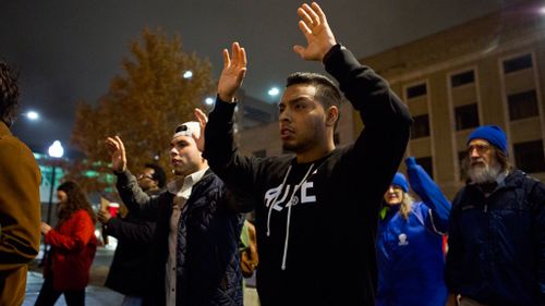 David Garcia holds his hands up during a protest in Lincoln, Nebraska. (AAP)