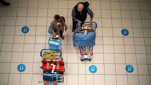 Travellers wait to board a flight at Johannesburg's International Airport in South Africa.