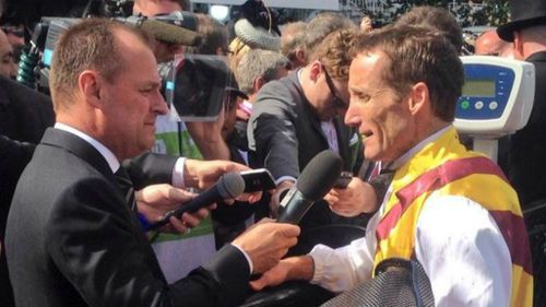 Damien Oliver talks to reporters after his winning Victoria Derby ride. (Twitter/Spring Carnival)