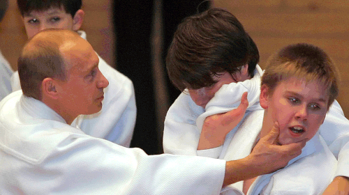 Putin, a judo black belt, shows off his skills at a master class in St Petersburg in 2005.  