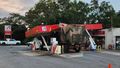 Military truck ploughs through Queensland petrol station