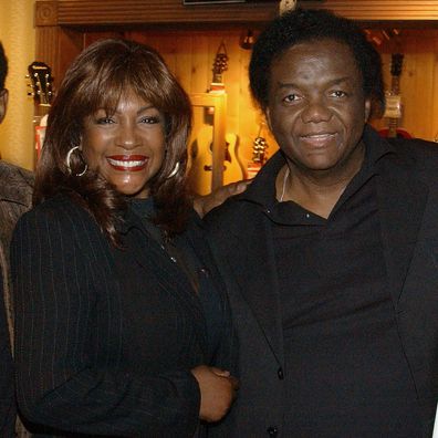 Singer Mary Wilson joins Brian Holland, Lamont Dozier and Eddie Holland of the legendary Motown songwriting team Holland-Dozier-Holland at a ceremony honoring the team's induction into Hollywood's RockWalk May 12, 2003 in Hollywood, California.  