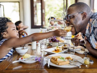 Guests having breakfast at hotel restaurant