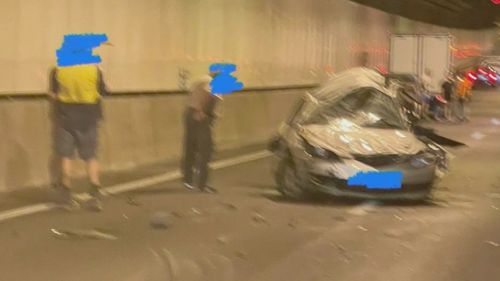 Two people have died and two others have been hospitalised after a three-vehicle crash in a major ﻿Brisbane tunnel.