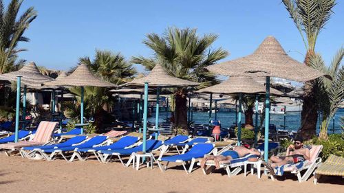 A file photo taken on January 9, 2016 shows tourists relaxing on the beach at the Bella Vista Hotel in Egypt's Red Sea resort of Hurghada. (AFP)