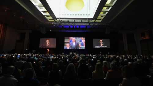 An audience listens to Mr Morrison's apology.