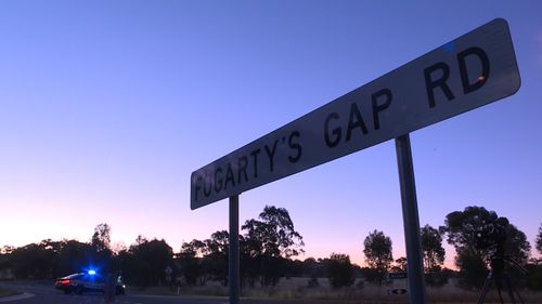 Victoria Police confirmed a blue Commodore station wagon had been travelling east on Fogartys Gap Road in Ravenswood.