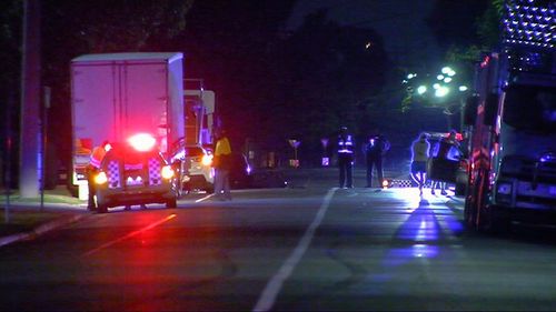 A driver has died after crashing into a parked tray truck in Melbourne's north.