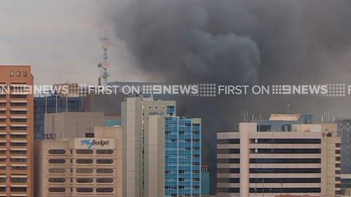 Smoke covers the Adelaide CBD after a fire broke out at the Hotel Grand Chancellor. (9NEWS)