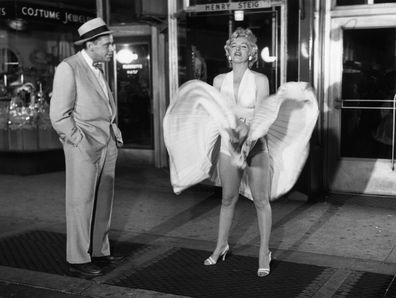 Tom Ewell and Marilyn Monroe in a scene from the movie The Seven Year Itch.