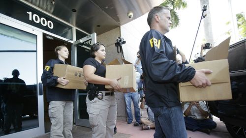US officials raided football headquarters in Miami following an earlier operation in Switzerland. (AAP)