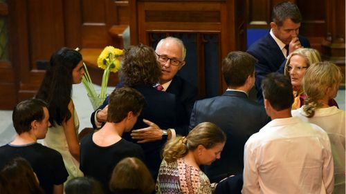 Prime Minister comforts families of Lindt siege victims at public memorial two years on