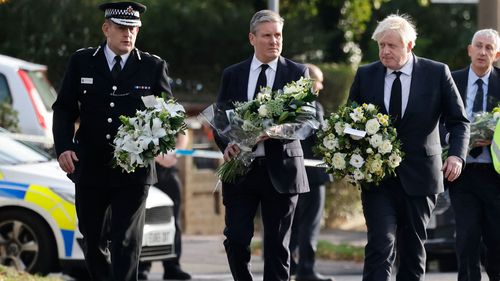 Boris Johnson, Keir Starmer and Ben-Julian Harrington carry floral tributes to scene of Sir David Amess fatal stabbing