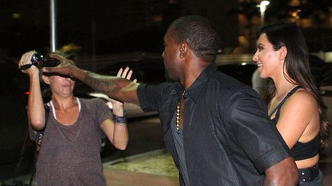 When Kanye attacks: Rapper lets loose at pap to protect Kim - who's wearing a see-through dress