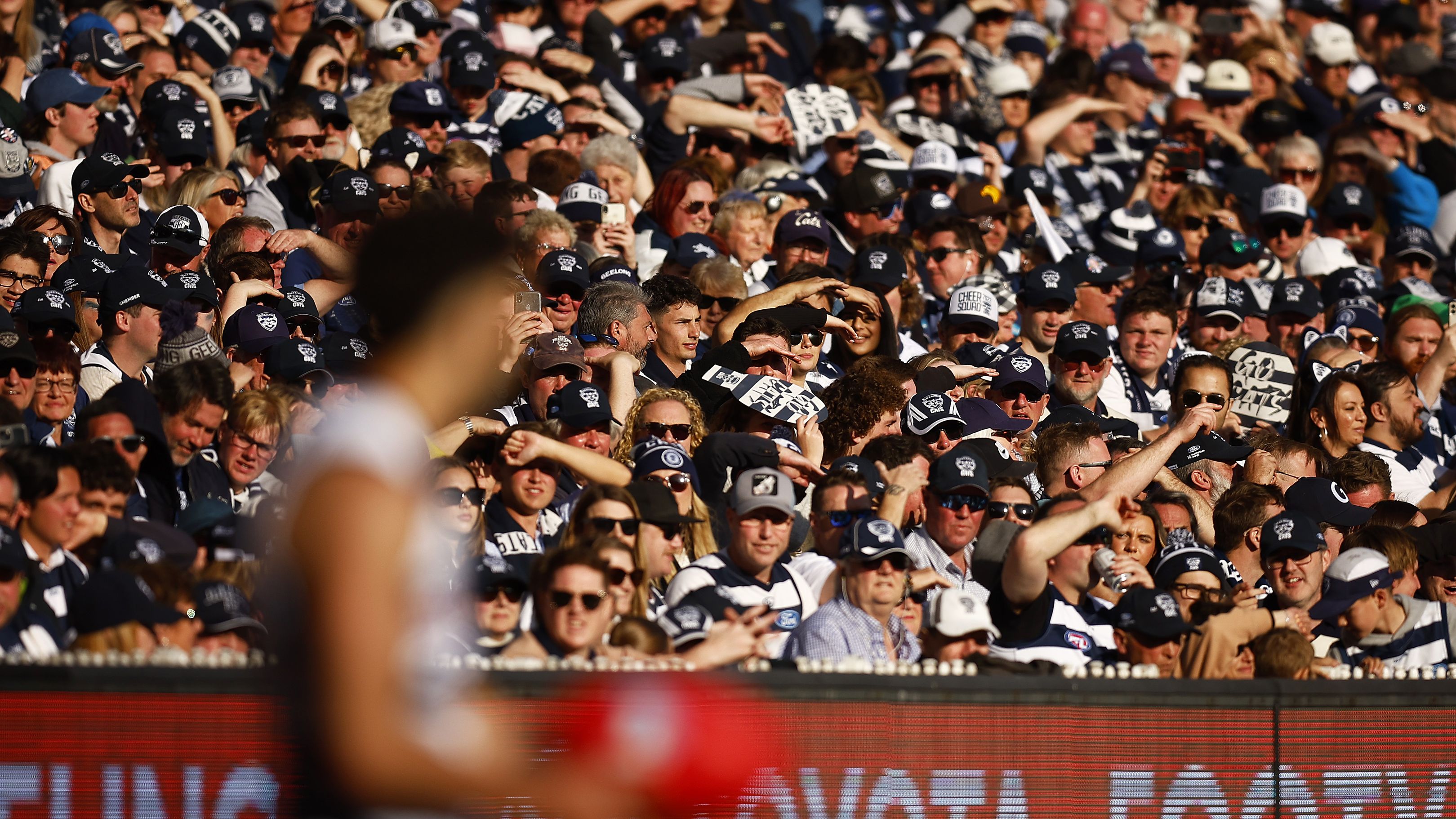 Cats fans look on as Tyson Stengle of the Cats lines up for goal during the 2022 AFL Grand Final match between the Geelong Cats and the Sydney Swans at the Melbourne Cricket Ground on September 24, 2022 in Melbourne, Australia. (Photo by Daniel Pockett/AFL Photos/via Getty Images)