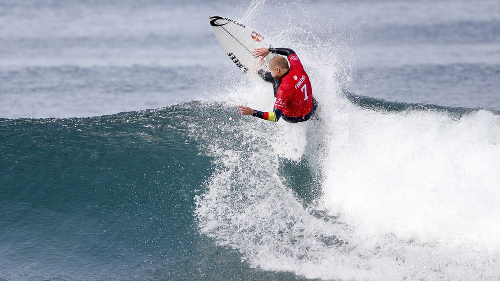 Mick Fanning ousts Kelly Slater in battle between surfing royalty at Bells Beach
