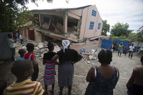 Emergency teams worked to provide relief in Haiti on Sunday after the quake killed at least 11 people and left dozens injured