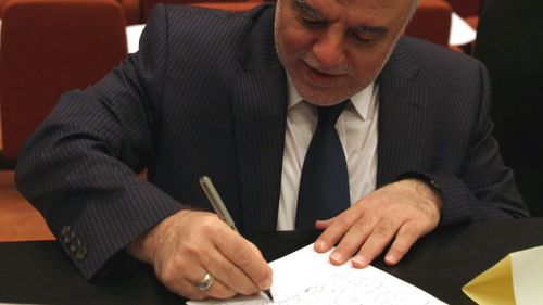 Iraqi president names new PM, spurns incumbent Maliki amid coup fears