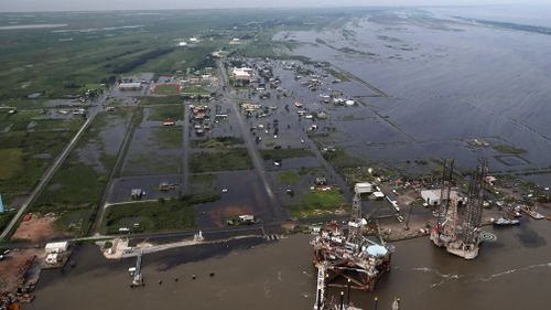 Flooding from Tropical Storm Harvey surrounds buildings in Sabine Pass, Texas, next to the Gulf of Mexico. (AP)
