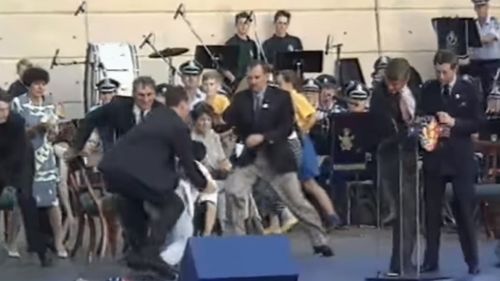 Ian Kiernan was among a group of men who tackled David Kang to the stage floor. Prince Charles (right) watches on.