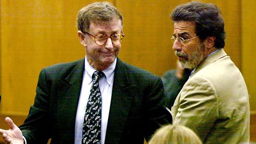 Michael Peterson reacts in 2003 after being found guilty of murdering his wife in Durham, N.C. At right is his attorney David Rudolf. (AAP)